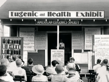 black and white photo of people listening to a talk on eugenics and health in Kansas 1927