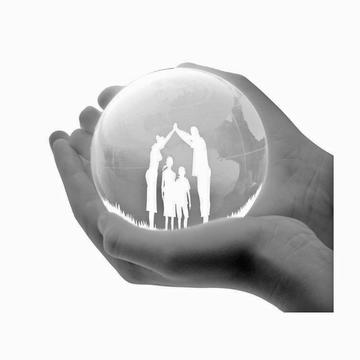 Image of a pair of hands holding a bubble with a family inside