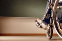 Hot topics: Disability the feet of a person sitting in a wheelchair