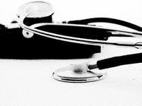 stethoscope a doctor's stethoscope lying on a desk
